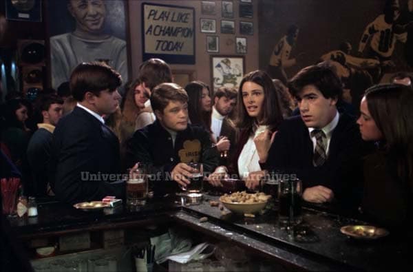 A scene from Rudy filmed inside Corby's, beneath the Play Like a Champion Today sign